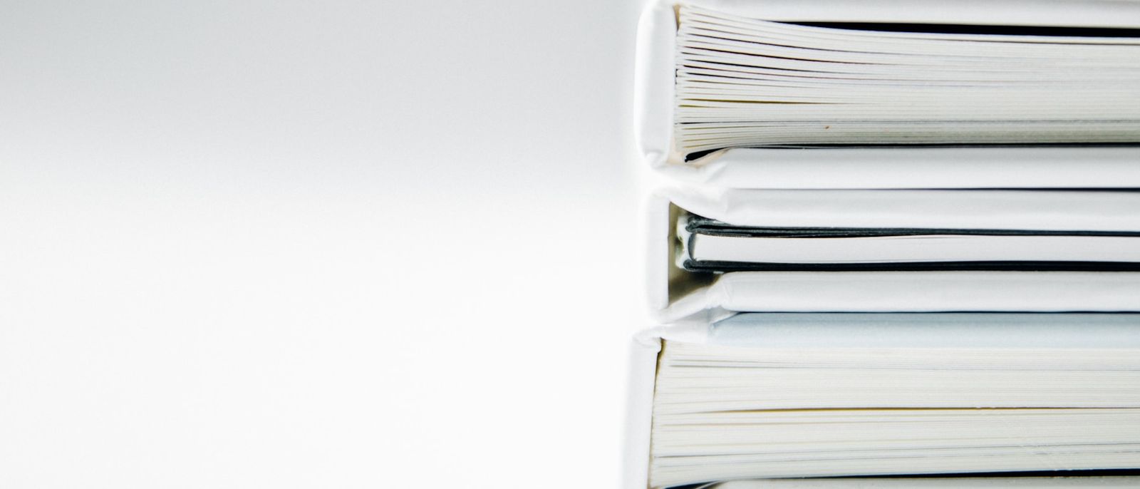 A stack of thick document folders