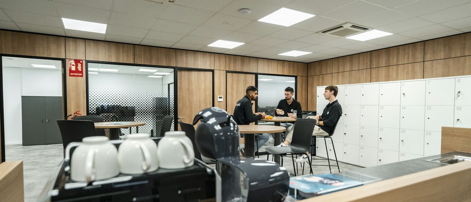 Three colleagues talking in an office